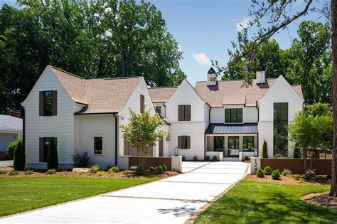 This modern Tudor style home in Charlotte has stunning curb appeal