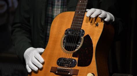 Kurt Cobain's MTV Unplugged guitar sells for $6m at auction - BBC News