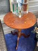 Round Wooden End Table with Decor- Trophies, Flowers, Framed Print and More - Kaufman Realty ...