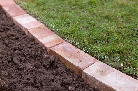 How to Edge a Lawn with Bricks - BBC Gardeners' World Magazine