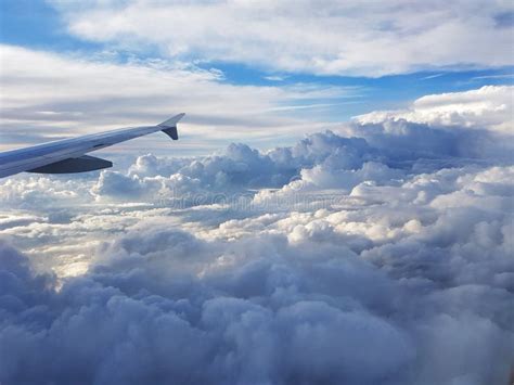 View from Plane Above Clouds Stock Photo - Image of sunlight, cumulus: 162279974