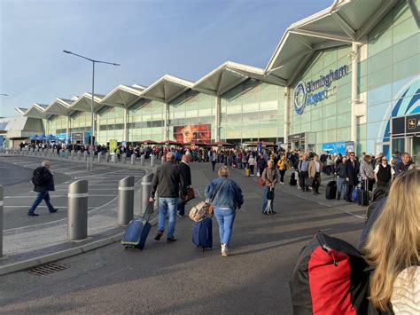 'Absolute chaos' at Birmingham Airport as thousands forced to queue outside