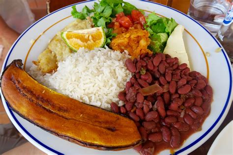 Check out this Costa Rican dish called casado. Rice, beans, plantains, salad and fish. Casado ...