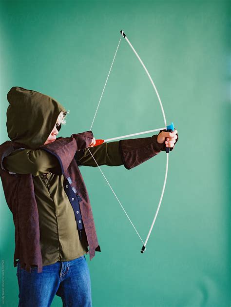 "Little Boy As Robin Hood Costume With Bow And Arrow" by Stocksy Contributor "Wendy Laurel ...