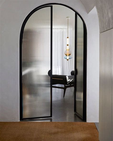 STUDIO BLACK INTERIORS on Instagram: “Arched steel doors with fluted ...