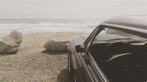Black Car Parked on the Seashore · Free Stock Photo