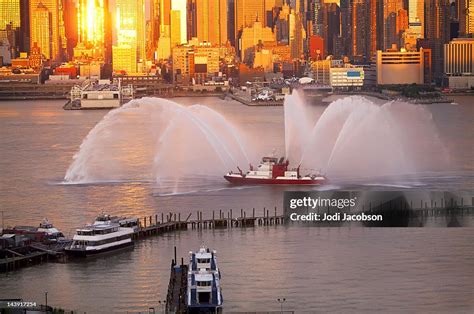 Fireboat At Sunset New York City Skyline High-Res Stock Photo - Getty ...