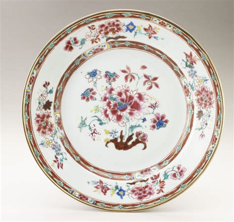 A set of Chinese plates painted in famille rose enamels with in the centre a camellia with ...