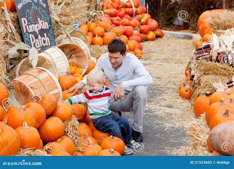 Family At The Pumpkin Patch Stock Photos - Image: 21523603