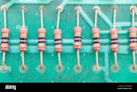 Row of resistors on circuit board Stock Photo - Alamy