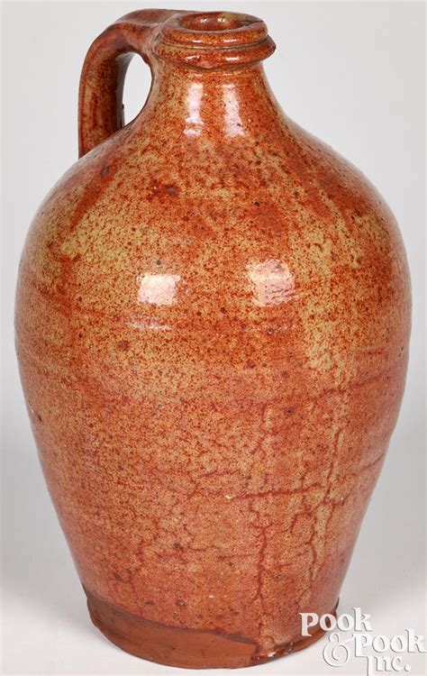 At Auction: New England redware jug, 19th c., probably Maine