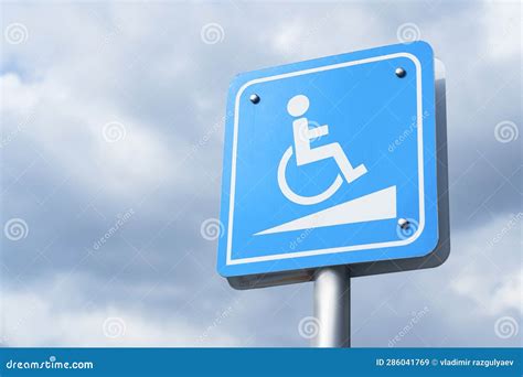 Wheelchair Ramp Sign Against Blue Sky, Copyspace. Stock Image - Image ...