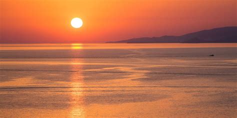 Sunset Reflections On Mykonos Island, Greece