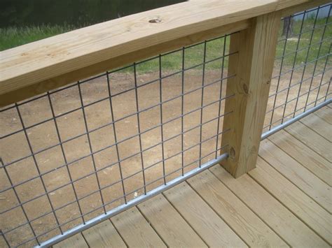 a wooden and metal fence on a deck