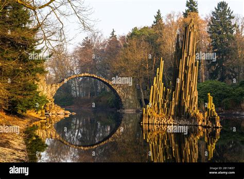 The Rakotzbrücke in the Rhododendronpark Kromlau at sunrise, Gablenz ...