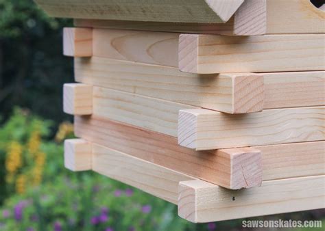 a close up of a bird house made out of wood