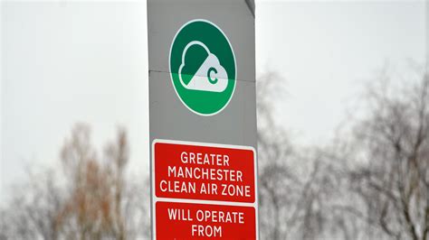 Stickers covering up Greater Manchester's Clean Air Zone signs to cost taxpayers six-figure sum ...