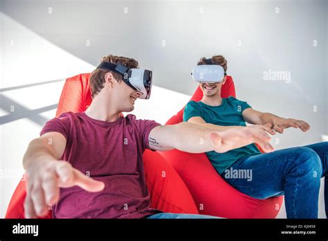 young men in vr headsets Stock Photo - Alamy