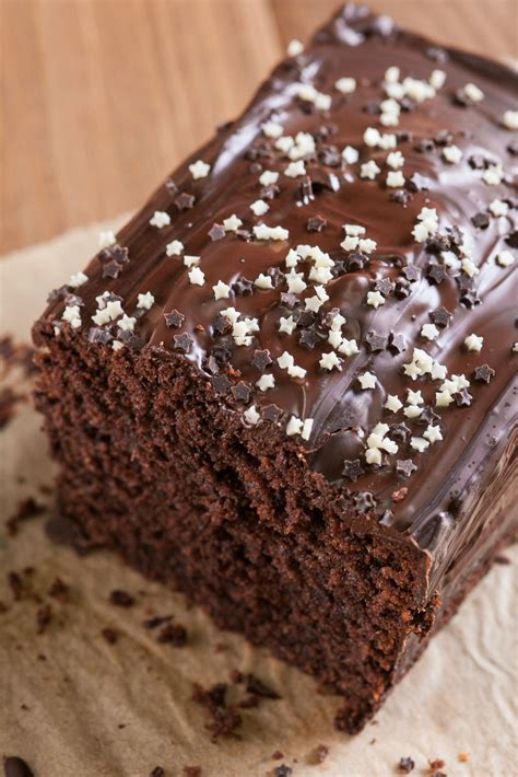 a piece of chocolate cake with white sprinkles