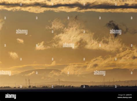 Clouds and wind turbines Stock Photo - Alamy