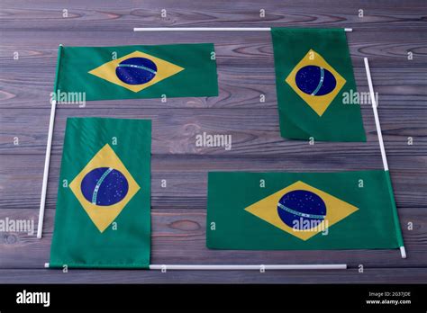 Composition of four brazilian flags on grey wood background Stock Photo - Alamy