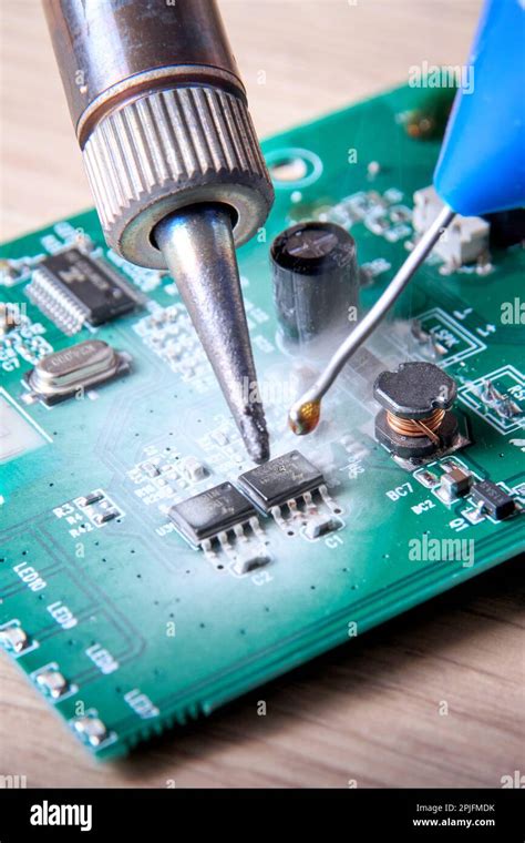 Unprofessional repair of the electrical board of the device, poorly performed repair work Stock ...