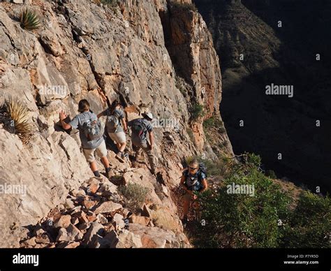 Backpackers negotiating a steep trail to visit the Cave of Domes on ...