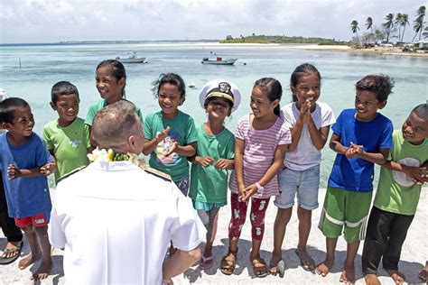 Rear Adm. Joey Tynch talks with Marshallese children. | Flickr