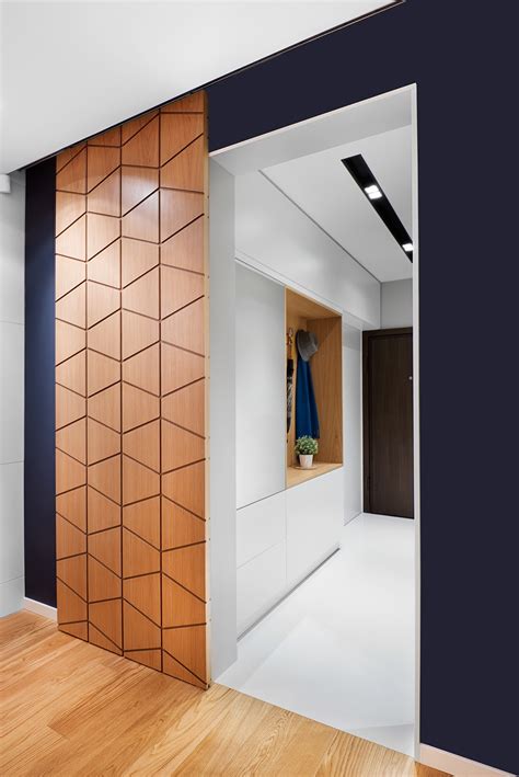 A peek at the entrance reveals a sliding door with a signature geometric pattern, giving way to ...