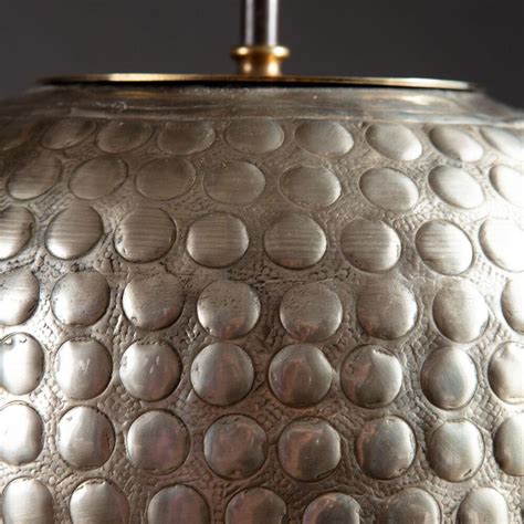 A Pair of Large Silvered Punched Metal Lamps | BADA