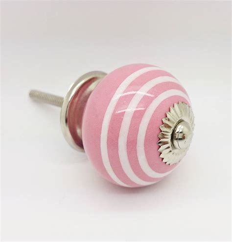 pink ceramic door knobs cupboard drawer pull handles by g decor | notonthehighstreet.com