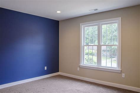 Master suite with blue royal blue accent wall ©Balducci Builders Blue ...