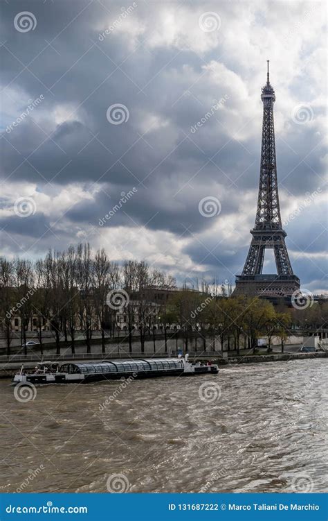 A Bateau-mouche on the Seine Near the Eiffel Tower on a Day with ...