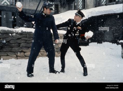 WHERE EAGLES DARE, Clint Eastwood, Derren Nesbitt engage in a snowball fight on set, 1968 Stock ...