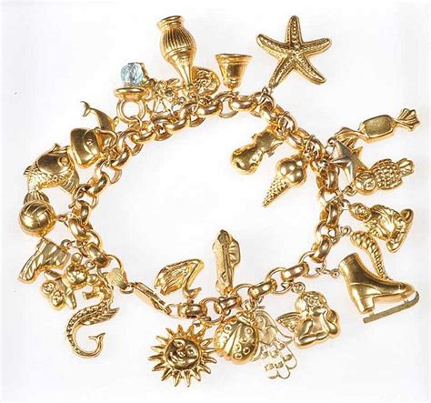 9CT GOLD CHARM BRACELET WITH 27 ASSORTED CHARMS