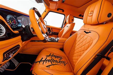 the interior of an orange sports car with happy halloween written on ...