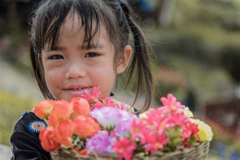 Premium Photo | Hmong tribe girls hold her flowers bamboo basket