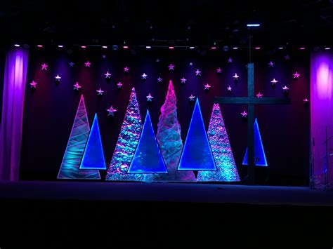 Our Christmas Backdrop for our stage at church this year. Amazing what a little screen, foil ...