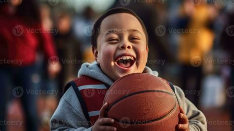 Little boy with down syndrome holding a basketball 26812613 Stock Photo at Vecteezy