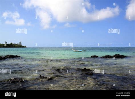 Coast of Upolu island and boat, Samoa Stock Photo - Alamy