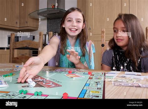 Children playing Monopoly Stock Photo - Alamy