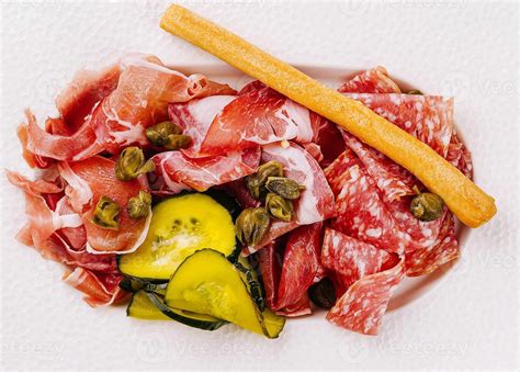 Assorted italian cold cuts platter with pickles and breadstick 45607438 Stock Photo at Vecteezy