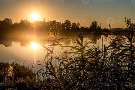 sunset on the lake. reflection 10016161 Stock Photo at Vecteezy