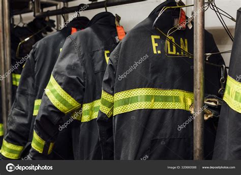 Firefighters' uniforms inside a firehouse Stock Photo by ©karrastock.gmail.com 320660588