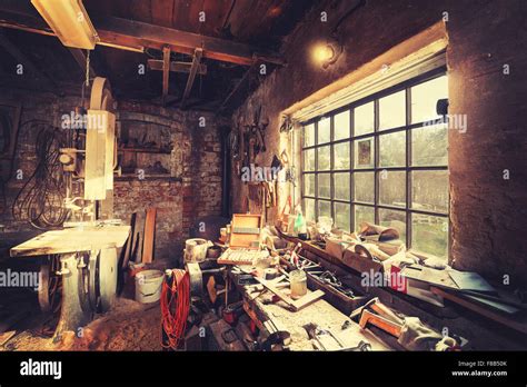 Vintage stylized old carpenter workshop interior Stock Photo - Alamy