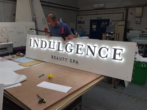 LED illuminated sign in the workshop | Exterior signage, Wayfinding ...