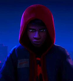 a man in a hoodie is looking at the camera with an evil look on his face