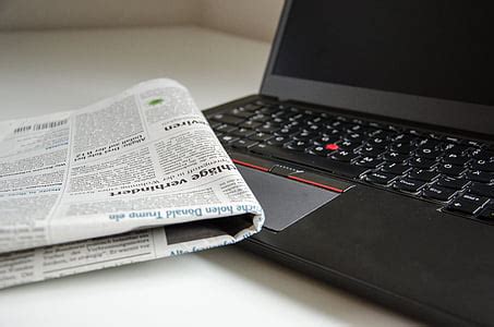 Royalty-Free photo: Pile of newspapers on rack | PickPik