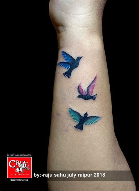 coloured flying bird tattoo for girl tattoo on wrist done at crazyink tattoo studio raipur. # ...
