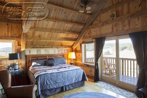 Bedroom in Sand Creek Post & Beam Barn Home - Loft living | Barn loft, Barn living, Barn with ...